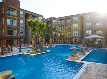 Resort-style swimming pool with cascading fountains